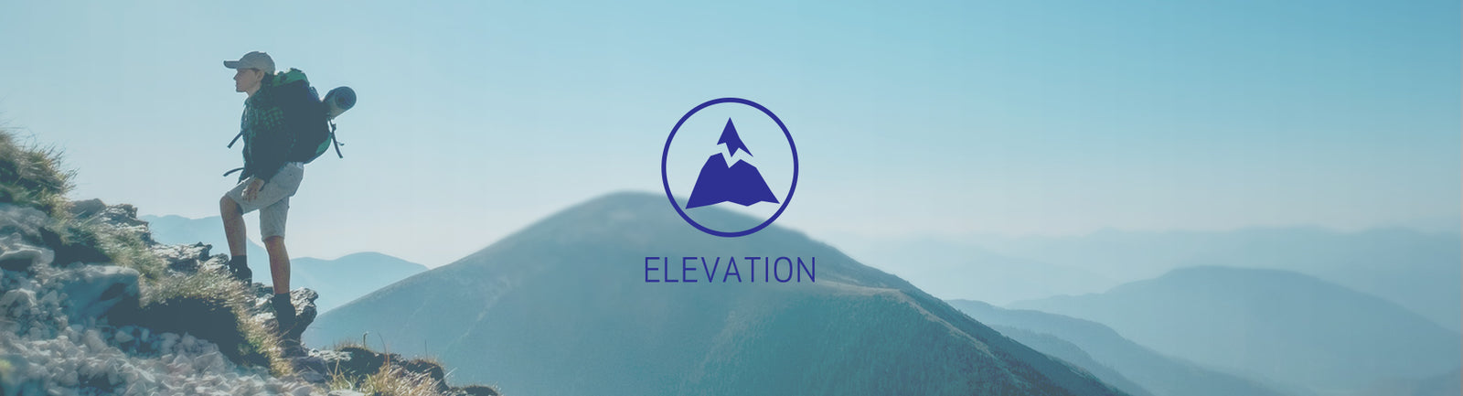 Man hiking up to the top of a mountain